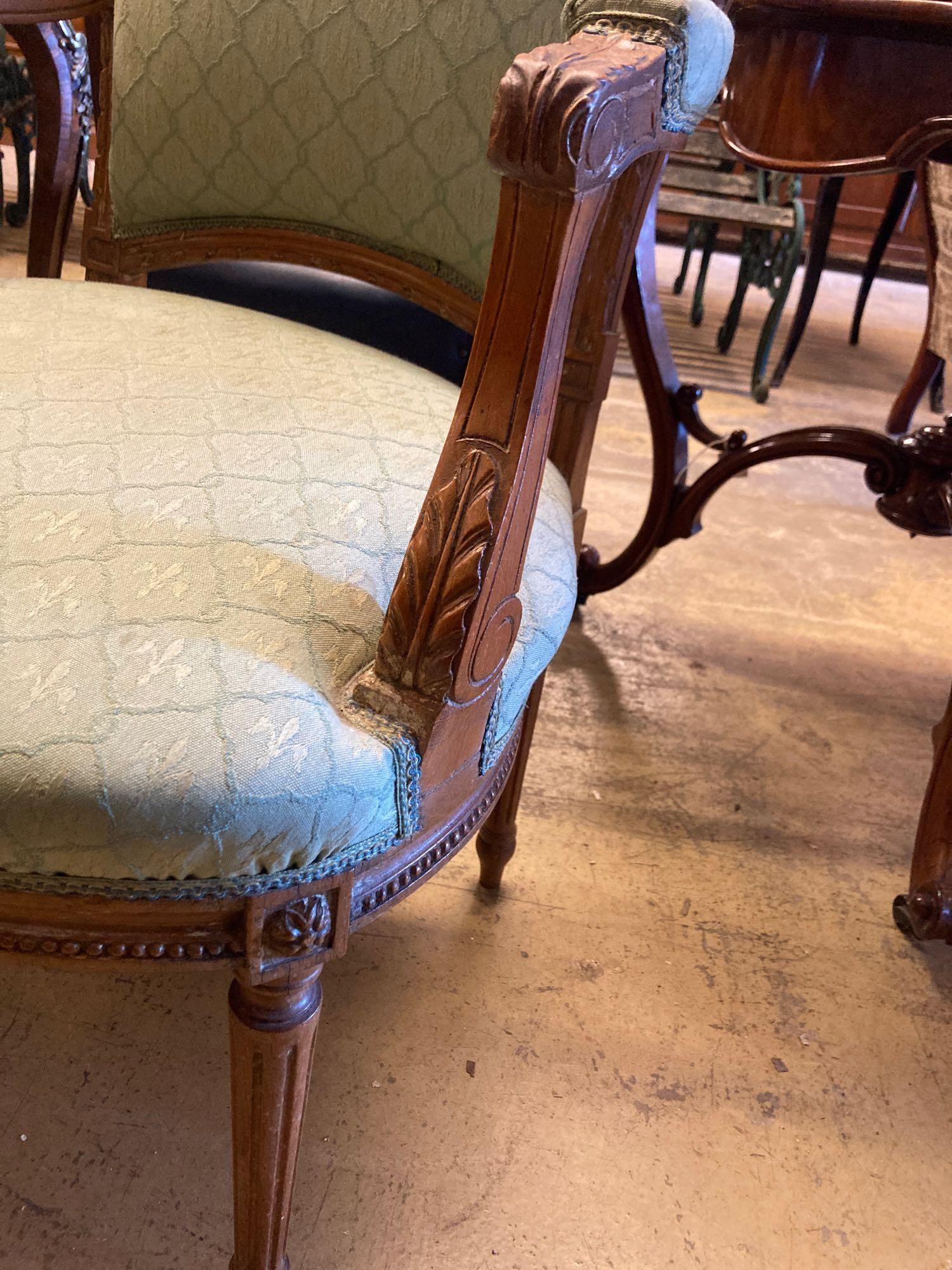 An Edwardian carved and stained beech fauteuil, width 58cm